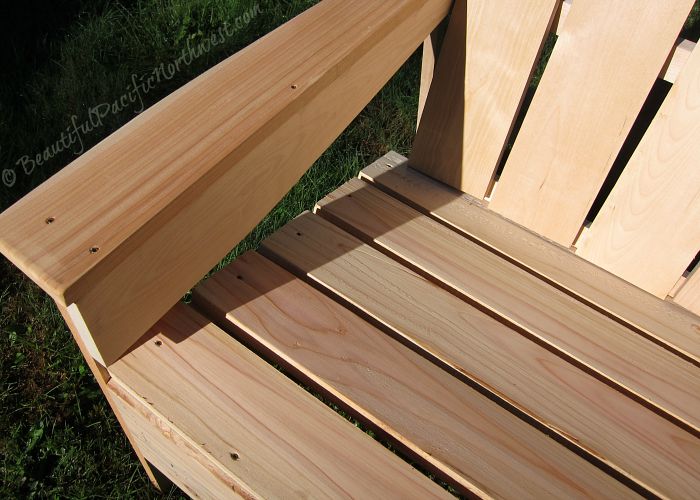 Seat and arms of this unfinished Adirondack chair are made from privately milled western red cedar wood