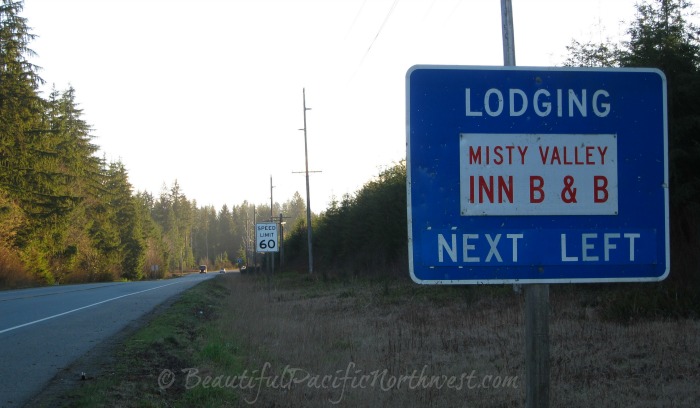 Highway sign along Hwy 101 West directing travelers to Misty Valley Inn B&B in Forks, WA